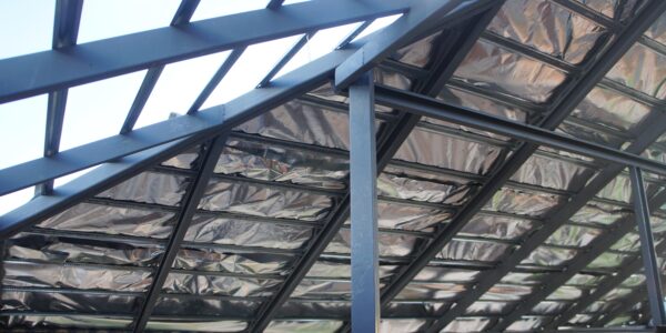 Steel,Roof,Structure,Under,Construction,With,Aluminum,Foil,Insulation,Sheet